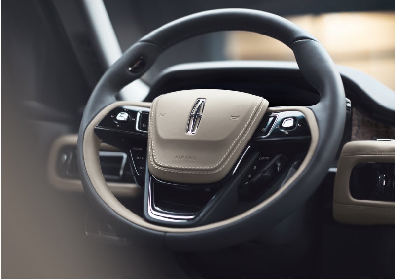The intuitively placed controls of the steering wheel on a 2023 Lincoln Aviator® SUV | Korum Lincoln in Puyallup WA