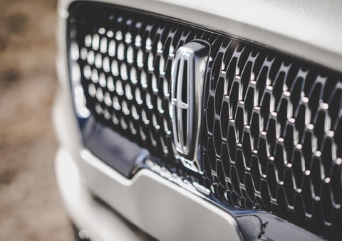 The grille of the 2024 Lincoln Aviator® Reserve model with an eye-catching repeated field of Lincoln Star logo shapes | Korum Lincoln in Puyallup WA