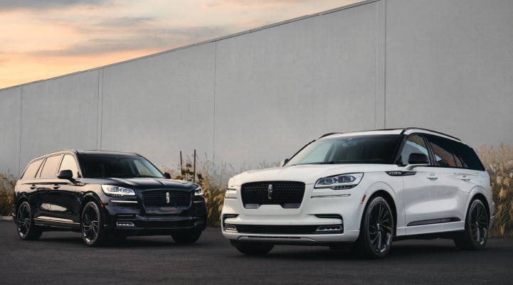 Two Lincoln Aviator® SUVs are shown with the available Jet Appearance Package | Korum Lincoln in Puyallup WA