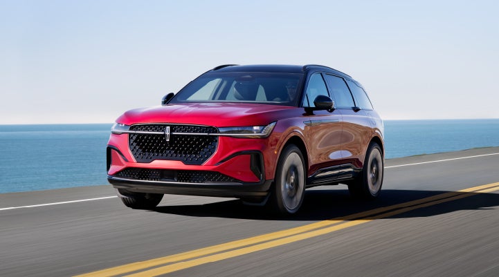 A 2024 Lincoln Nautilus® SUV is being driven on a seaside roadway. | Korum Lincoln in Puyallup WA