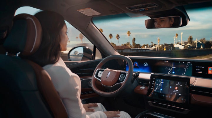 A person is shown driving hands-free on the highway with available Lincoln BlueCruise technology. | Korum Lincoln in Puyallup WA