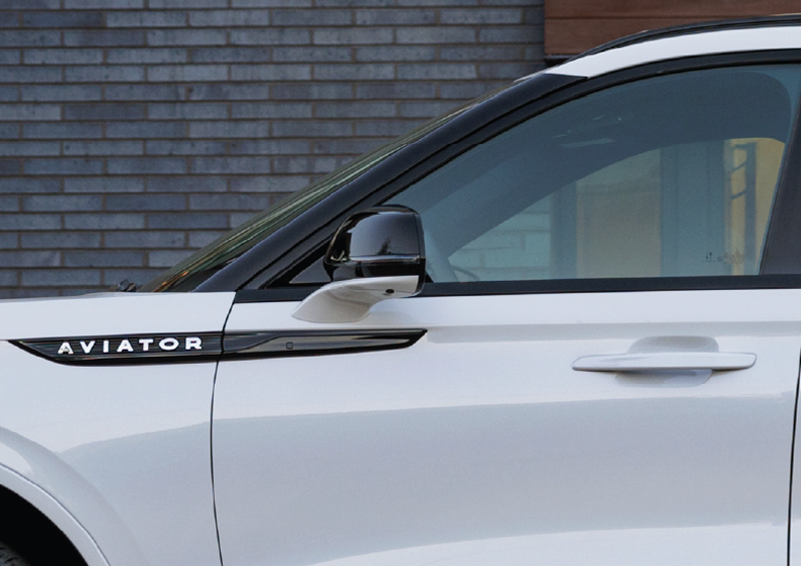 The driver’s door of a white 2025 Lincoln Aviator® SUV is showcased. | Korum Lincoln in Puyallup WA