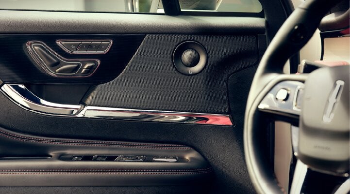 A Revel® audio speaker is shown in the driver's side door of a 2025 Lincoln Corsair® SUV. | Korum Lincoln in Puyallup WA