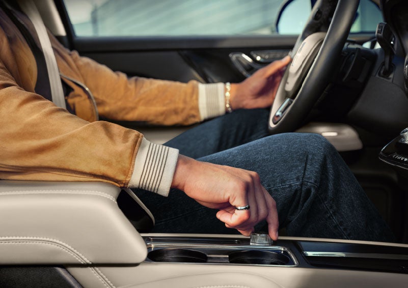 The driver of a 2024 Lincoln Corsair® SUV is shown selecting the drive mode. | Korum Lincoln in Puyallup WA