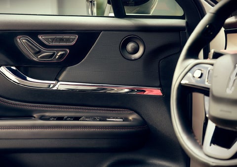 The driver of a 2024 Lincoln Corsair® SUV is shown selecting the drive mode. | Korum Lincoln in Puyallup WA