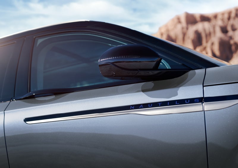 Blue lettering on the side of the vehicle that reads nautilus indicates the available hybrid powertrain. | Korum Lincoln in Puyallup WA