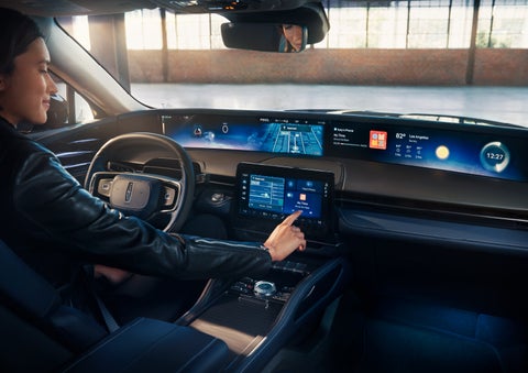The driver of a 2025 Lincoln Nautilus® SUV interacts with the center touchscreen. | Korum Lincoln in Puyallup WA