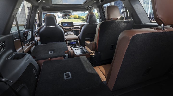 One side of the PowerFold® third-row seat and a second-row seat are folded forward in the 2026 Lincoln Aviator® SUV. | Korum Lincoln in Puyallup WA