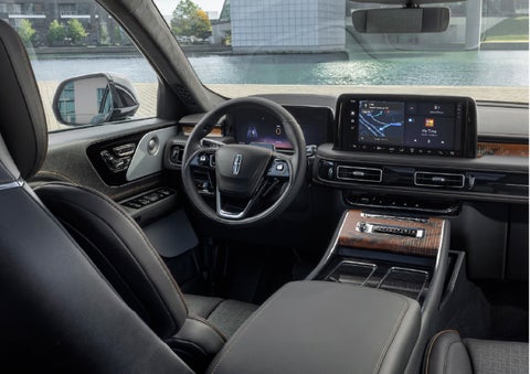 The interior of the 2026 Lincoln Aviator® SUV is shown parked with a view of a harbor through the windshield. | Korum Lincoln in Puyallup WA