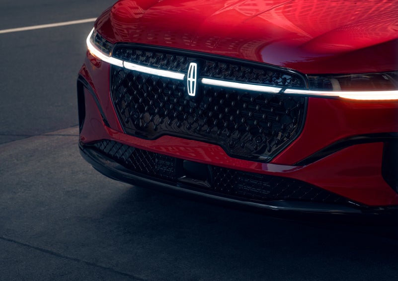 The available front LED light bar and center Lincoln Star logo glow at dusk. | Korum Lincoln in Puyallup WA