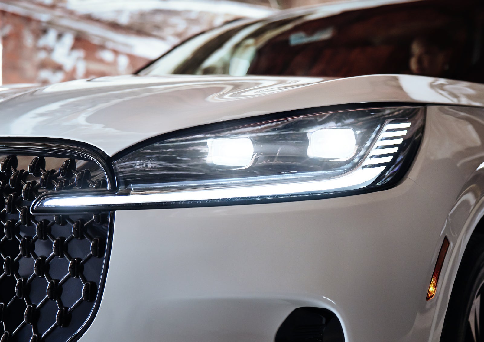 A close-up of a headlamp on the 2027 Lincoln Aviator® SUV is shown. | Korum Lincoln in Puyallup WA